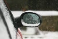 Car wing mirror covered up with snow Royalty Free Stock Photo