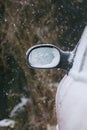 Car wing mirror covered up with snow Royalty Free Stock Photo