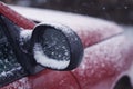 Car wing mirror covered up with snow Royalty Free Stock Photo