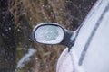Car wing mirror covered up with snow Royalty Free Stock Photo