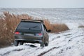 The car on a winter dirt road