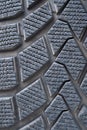 Car winter tire detail closeup, used car tires texture