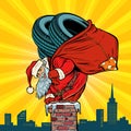 Car winter tires. Santa Claus with gifts climbs into the chimney