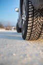 Car with winter tires on a snowy road Royalty Free Stock Photo