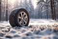 car winter wheel on icy winter snow