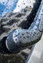Car wiper, raindrops and reflection of a building in the glass Royalty Free Stock Photo