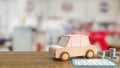 The toy wood car and blue calculator on wood table 3d rendering Royalty Free Stock Photo