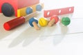 Car wooden constructor for preschool education. Children`s activity with screwdriver and screws. Baby skills concept