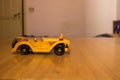 Car wooden model toy on a wooden table Royalty Free Stock Photo