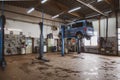 In car workshop there are lifting platforms for repairing cars