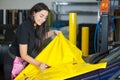 Car wrapping specialists straightening vinyl foil or film Royalty Free Stock Photo
