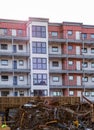 Car wreck yard with residential building in close proximity