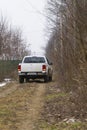 Testing a 4x4 jeep car at the edge of a forest 