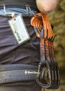Carabeaners hanging from a rock climbers belt