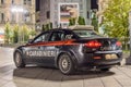 Carabinieri Italian Police Vehicle with Officer Inside. Fast Car Patrol the Area at Piazza del Duomo Square, Milan, Italy.