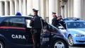 Carabinieri with Mitsubishi iMIEV and policeman with a BMV at Vatican City