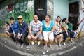 Caracas, Miranda State / Venezuela 04-06-2012 : Young people and adults sitting sharing and smiling in a street in the Nazareno ne Royalty Free Stock Photo