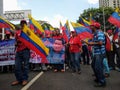 Supporters of Nicolas Maduro march in Caracas to commemorate the first anniversary of reelection