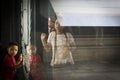 Caracas, Venezuela. Shadows and reflexes of girls and little boy on glass inside National Pantheon