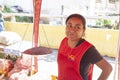 Caracas Venezuela 21/01/2012.Woman smilling sells fruits and vegetables in Street market in Guanabano Bridge in La Baralt Aveneu