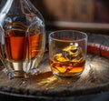 Carafe of whisky and glass of whisky on old wooden cask at the dark background Royalty Free Stock Photo