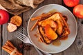 Caramel apple cinnamon french toast. Overhead view table scene on dark wood. Royalty Free Stock Photo