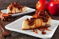 Autumn caramel apple pecan cheesecake slices, side view table scene against wood