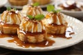 caramel apple tartlets on a white plate