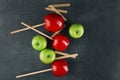 Caramel apples and wooden sticks, top view Royalty Free Stock Photo