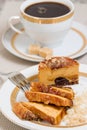 Caramel cake and a cup of coffee on background