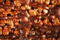 Caramel and chocolate puffed rice background. Rice krispies bar, copy space.