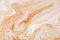 Caramel dynamic and fluid raster texture. Abstract acrylic paints mixt color background. Dyeing, liquid flow surface