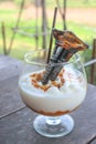 Caramel frappe coffee with syrup bottle at top Royalty Free Stock Photo