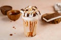 Caramel frappe with Ice Cream sandwich with chocolate served in glass isolated on table top cafe dessert Frappuccino Blended drink