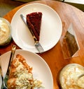 Caramel frappuccino and red velvet cake and almond croissant in coffee shop Surabaya.