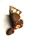 Caramel and hazelnut cake piece with cut candied pinecone