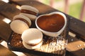 Caramel Macaroons with salted caramel on wooden background Royalty Free Stock Photo