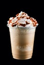 Caramel milkshake in take away cup isolated on black Royalty Free Stock Photo