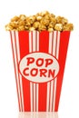 Caramel popcorn in a decorative paper popcorn cup Royalty Free Stock Photo
