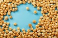 Caramel popcorn by a ripple on a blue background in the form of a frame