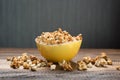 Caramel popcorn in a yellow bowl on a wooden table background Royalty Free Stock Photo