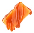 Caramel sauce flowing on caramel candy, isolated on white background. Levitating caramel candy