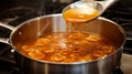 Caramel Symphony: Liquid Gold Dance in a Pan Euphoria Royalty Free Stock Photo