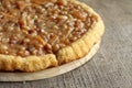Caramel tart on wooden background Royalty Free Stock Photo