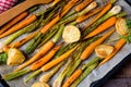 Caramelised carrots, spring onions and baked potatoes Royalty Free Stock Photo