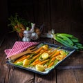 Caramelised carrots, spring onions and baked potatoes Royalty Free Stock Photo