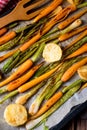 Caramelised carrots, spring onions and baked potatoes Royalty Free Stock Photo