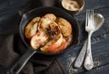 Caramelized apples with cinnamon in a vintage pan Royalty Free Stock Photo