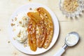 Caramelized Bananas, Ice-cream and Chopped Nuts Dessert Royalty Free Stock Photo