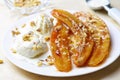 Caramelized Bananas, Ice-cream and Chopped Nuts Dessert Royalty Free Stock Photo